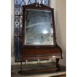 A Victorian mahogany wall mirror broken arch cornice above rectangular mirror and curved lidded