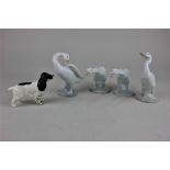 A Beswick model of a Spaniel and four Lladro porcelain geese, 17cn