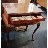 A Chinese canteen table two fitted drawers together with a silver plated service for a setting of