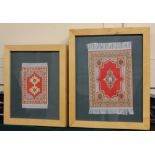 Two framed miniature rugs, both red ground, largest 24cm by 14.5cm