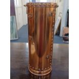 A riveted copper studded stick stand 46cm high