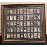 A framed set of fifty John Player & Sons cigarette cards of the Kings and Queens of England (two