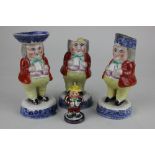 Three Staffordshire pottery cruet figures 14cm high, and a smaller example, together with two