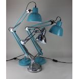 A pair of blue painted angle poise table lamps and another smaller chrome angle poise lamp