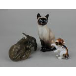 A Royal Doulton Siamese cat HN2655 a Royal Doulton kitten HN2582, 8cm and a Copenhagen model of a