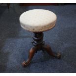 A Victorian circular piano stool upholstered adjustable seat on spiral turned stem and tripod