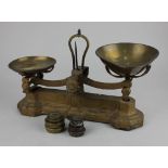 A set of W&T Avery scales with brass pans and various weights, 35cm