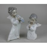 Two Lladro porcelain figures of cherubs, one playing an instrument 18cm high