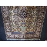 A pair of Middle Eastern hand knotted rugs possibly Iranian, floral cream field with vase and