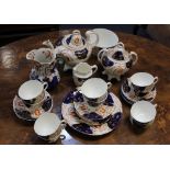 A collection of Old Castle and similar Imari pattern tea and tableware, comprising teapot, jug,