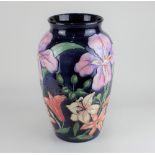 A large Moorcroft pottery 'Tigris' pattern vase designed by Rachel Bishop, with tubelined lilies and