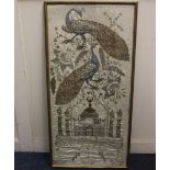 A framed Indian silk panel embroidered with peacocks and flowers above a temple 97cm by 46cm