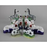 A pair of Staffordshire pottery figures of zebras 17cm high, a pair of greyhound quill holders, a
