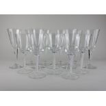 A set of seven Dartington crystal champagne flutes, and one similar, together with a set of six