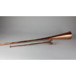 A copper and brass hunting horn 108.5cm, and another smaller example 43cm