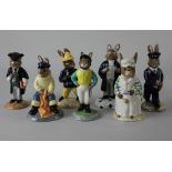 Seven Royal Doulton 'Bunnykins' figures comprising Lawyer, Jockey, Fireman, Fisherman, Cook, Postman