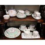A Minton porcelain Haddon Hall part tea and dinner service comprising tea pot, milk bowl, sugar bowl
