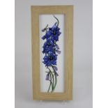 A Moorcroft pottery 'Delphinium' framed plaque 31.5cm by 12cm