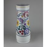 A Poole pottery vase of waisted cylindrical form, with floral decoration on white ground, 39.5cm