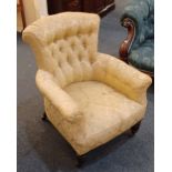 A Victorian button upholstered armchair on turned legs and castors (a/f)