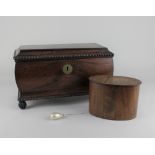 A 19th century rosewood tea caddy of bombe sarcophagus form with gadrooned edge on carved ball