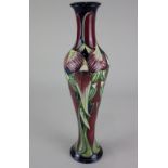 A Moorcroft pottery 'Trinity' pattern slender baluster vase, 31.5cm high