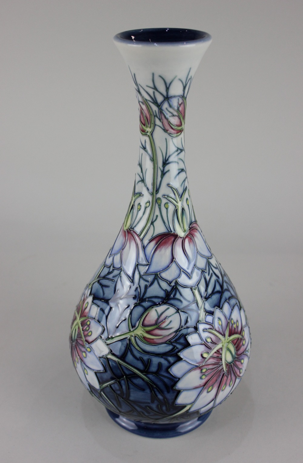 A Moorcroft pottery 'Love In The Mist' pattern bottle vase, 31.5cm high