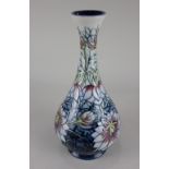 A Moorcroft pottery 'Love In The Mist' pattern bottle vase, 31.5cm high