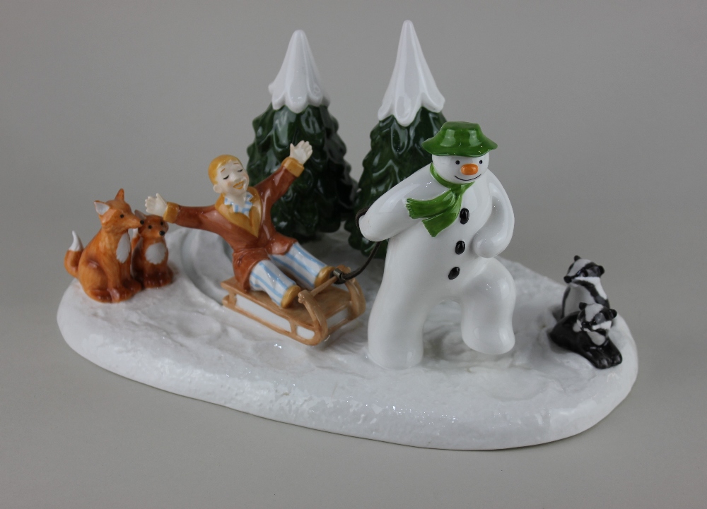 A Coalport porcelain 'The Snowman' limited edition figure group 'Winter Fun', number 342 of 1500,