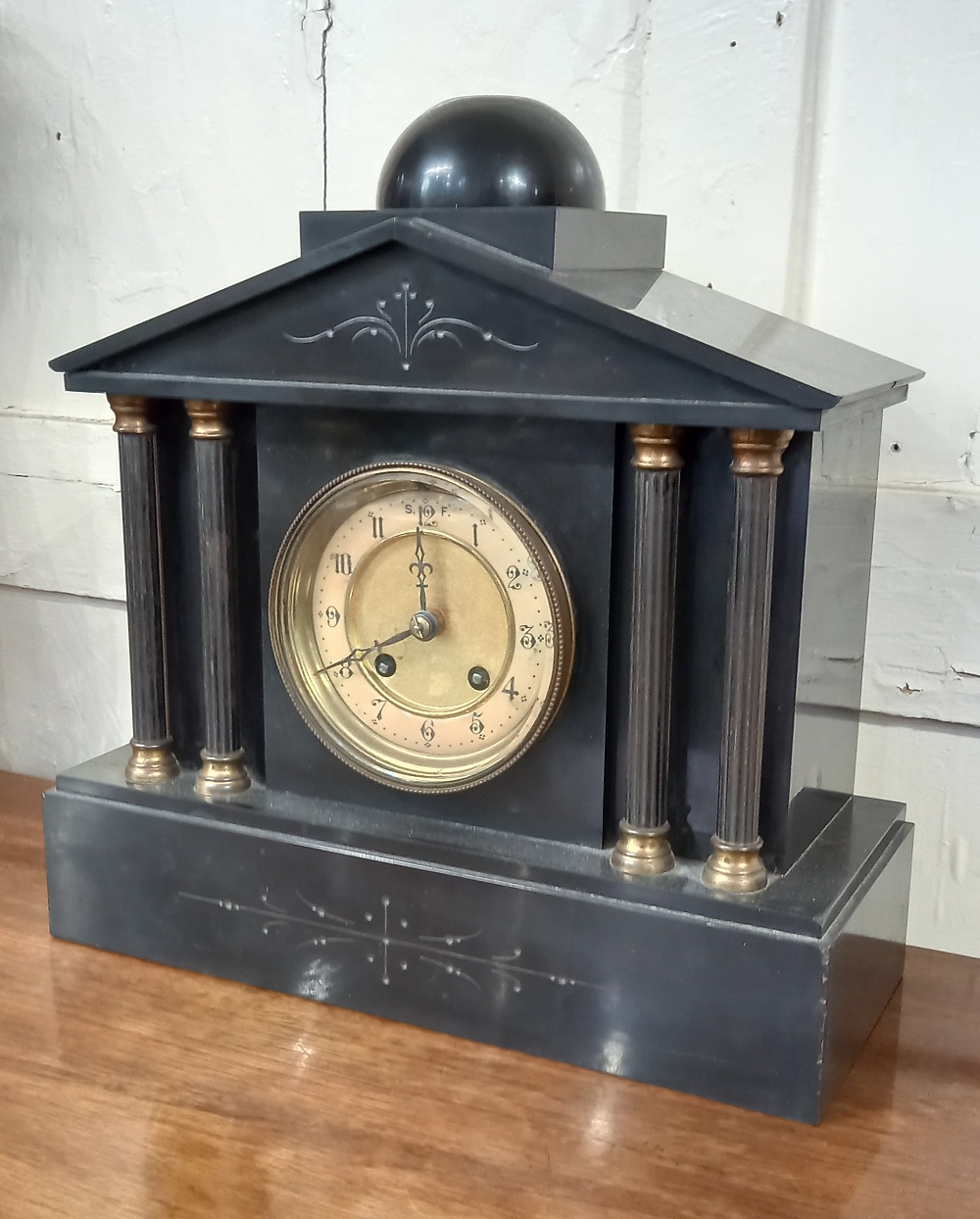 A Victorian black slate mantle clock Classical architectural case with brass mounted columns, 32cm