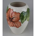 A Moorcroft pottery Hibiscus pattern baluster vase, cream ground, 19cm high