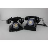 Two black bakelite telephones