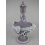 A Wedgwood lilac jasperware vase baluster form with lid (a/f repaired), green Classical plaques