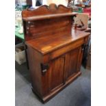 A Victorian mahogany chiffonier raised shelf back with scroll surmount above drawer and two