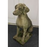 A stone composition garden ornament of a seated dog ht 72cm