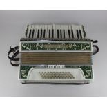 A Hohner 'Verdi I' piano accordion with leather straps, cased, together with a booklet 'Feldman's