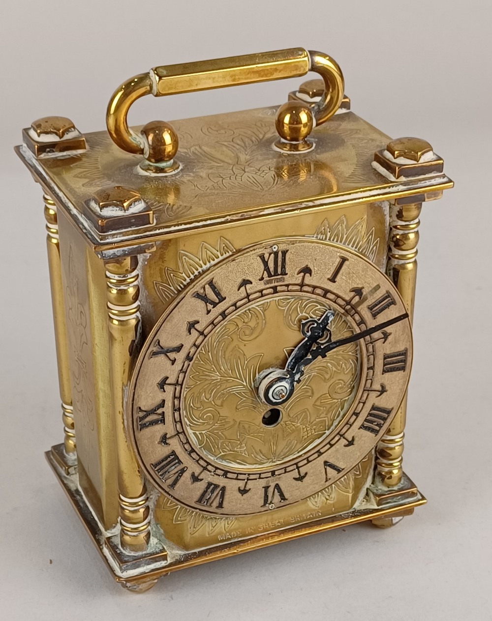 A Smiths brass carriage clock, the chapter ring with Roman numerals, in engraved case, 11cm high,