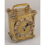 A Smiths brass carriage clock, the chapter ring with Roman numerals, in engraved case, 11cm high,