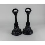 A pair of black painted cast iron door stops 33.5cm high