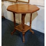 An oak octagonal side table with four baluster supports and undershelf, 61cm