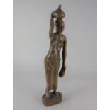 A carved wood figure of an African woman 46.5cm high