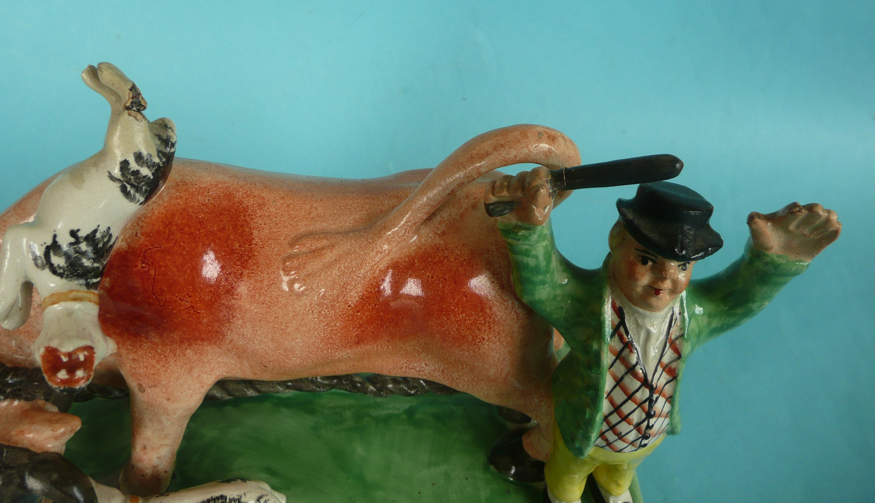 Bull Bating: a colourful Staffordshire pottery group in the manner of Obadiah Sherrat modelled - Image 4 of 4