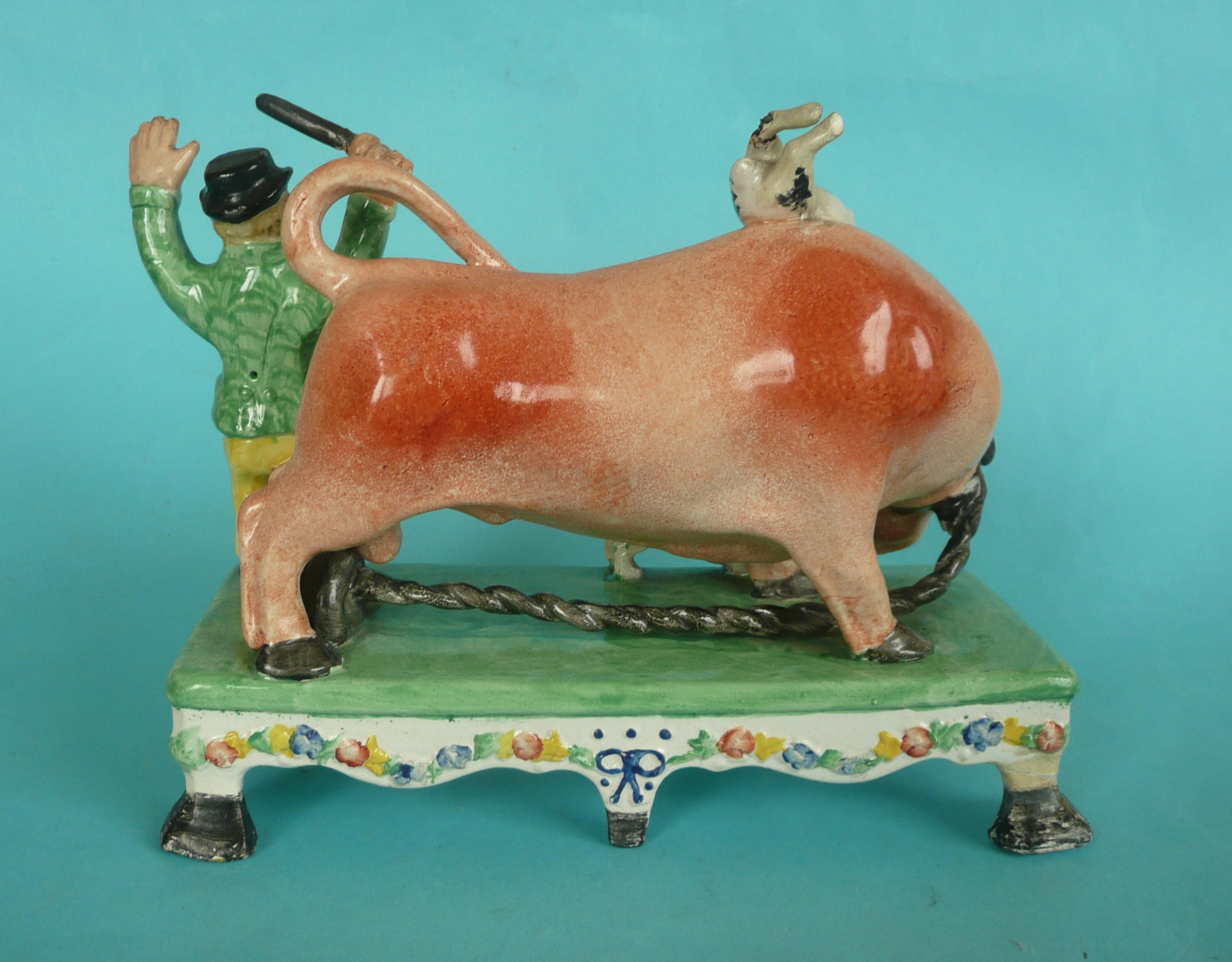 Bull Bating: a colourful Staffordshire pottery group in the manner of Obadiah Sherrat modelled - Image 2 of 4