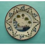 (Commemorative) Ballooning: a Delft polychrome plate, probably Lambeth, painted with a garden