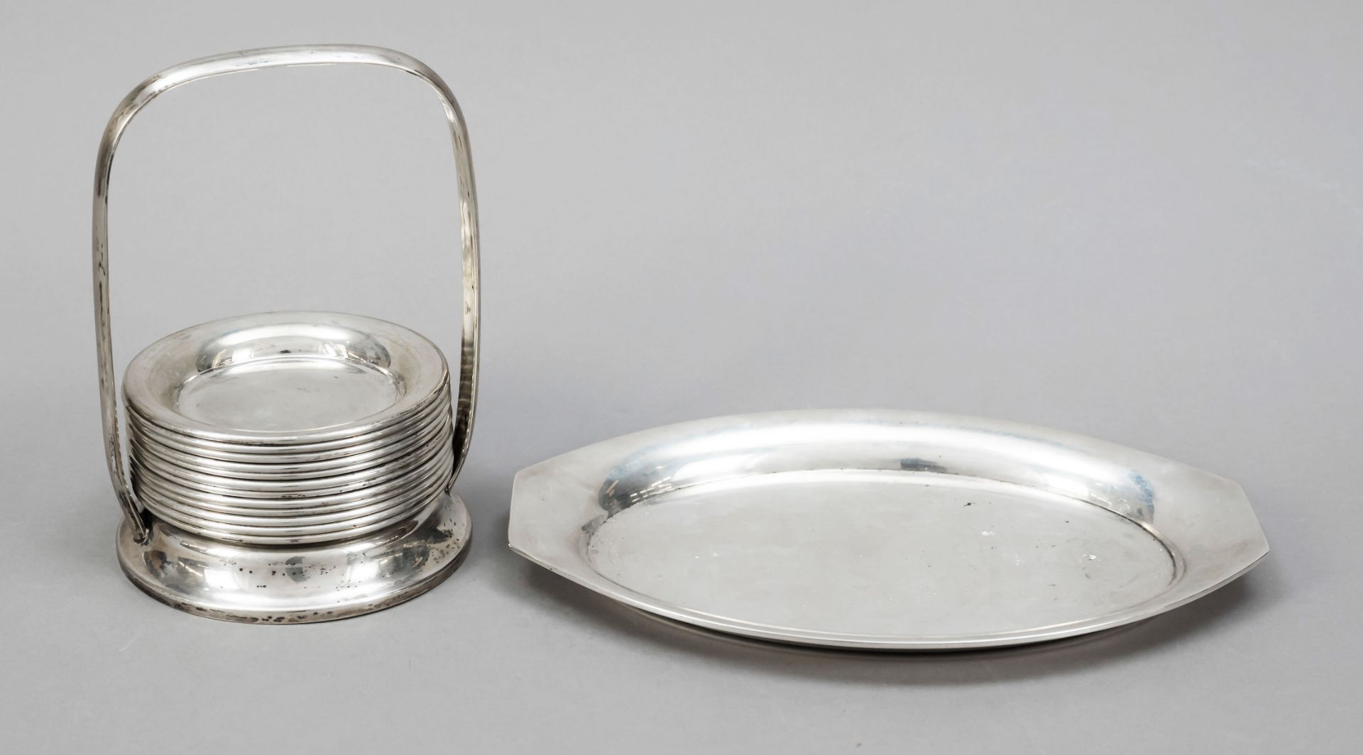 Twelve coasters in stand, Austria, 20th c., silver 800/000, smooth form, stand with overlapping