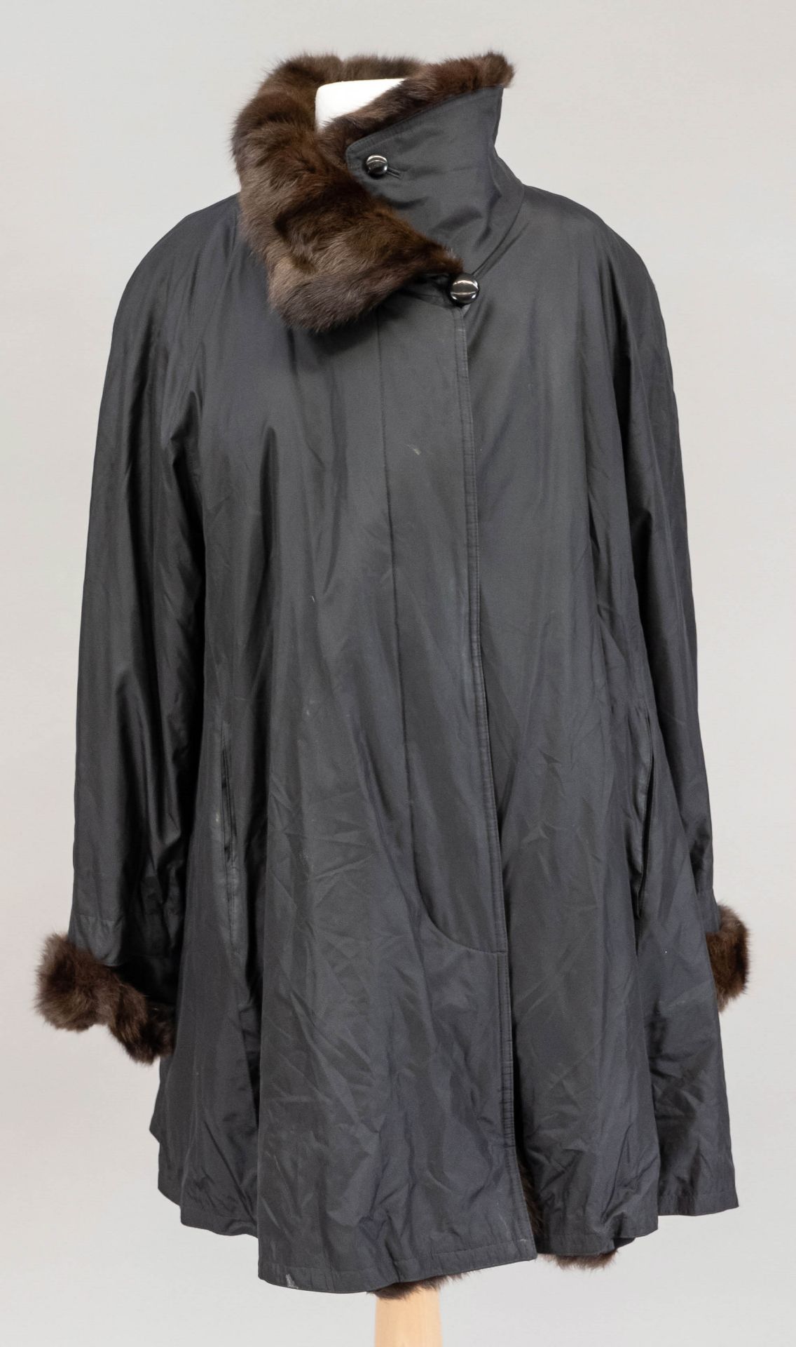 Ladies coat with fur trim, in the lining as embroidery called Jobis. Size indication 36, light