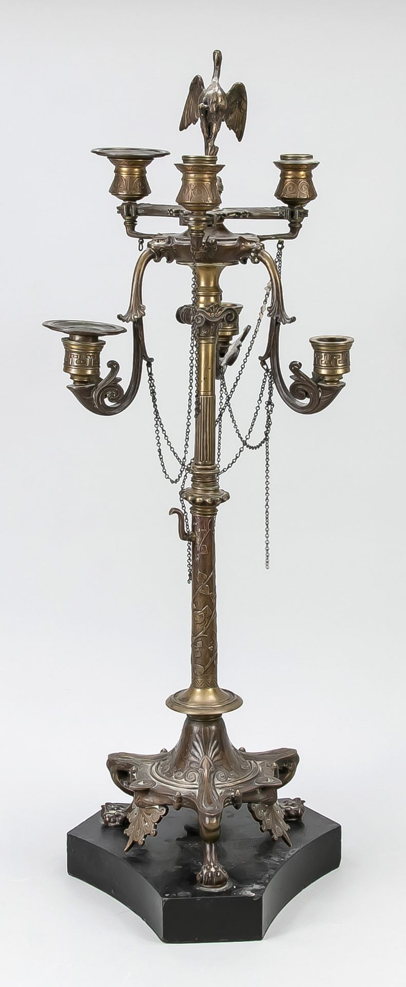 Large candlestick, late 19th century, bronze, polished stone. Ornamented tripod base on a tripod