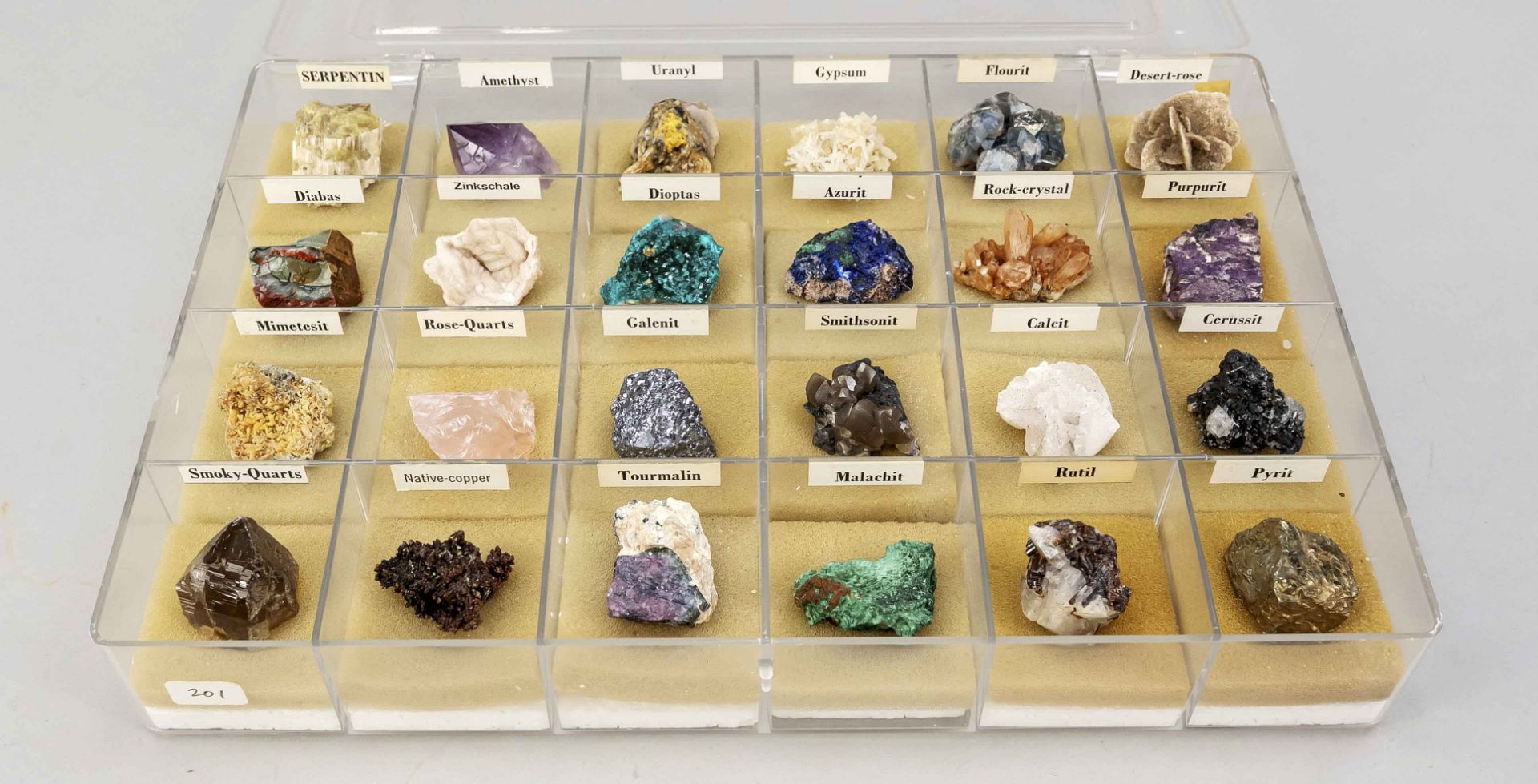 Collection of minerals, 24 pieces in a display case. Each in a compartment with foam cushion, each