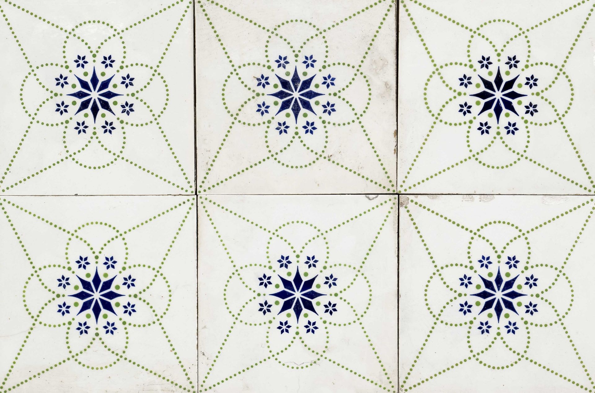 55 Tiles Art deco tiles, 1930s. Stenciled spray decoration in dark green and blue with stylized