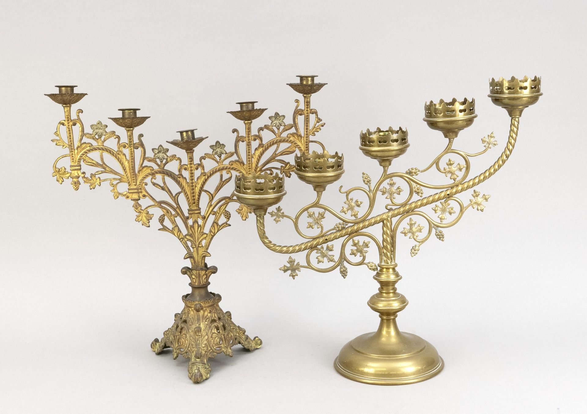 2 altar candlesticks, end of 19th c., bronze/brass (1 x with residual gilding). Both in different